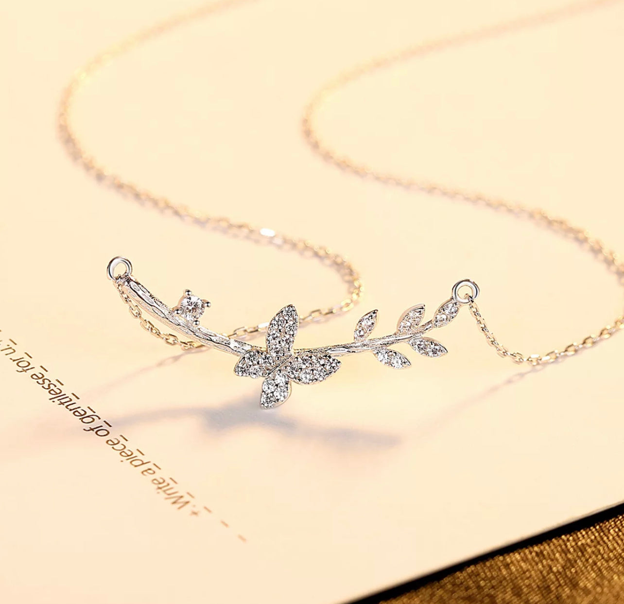 The Butterfly on a twig necklace by Intricata co.