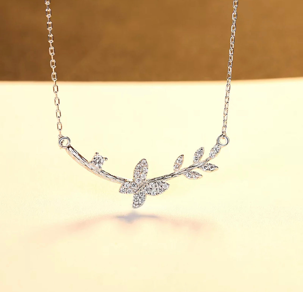 The Butterfly on a twig necklace by Intricata co.