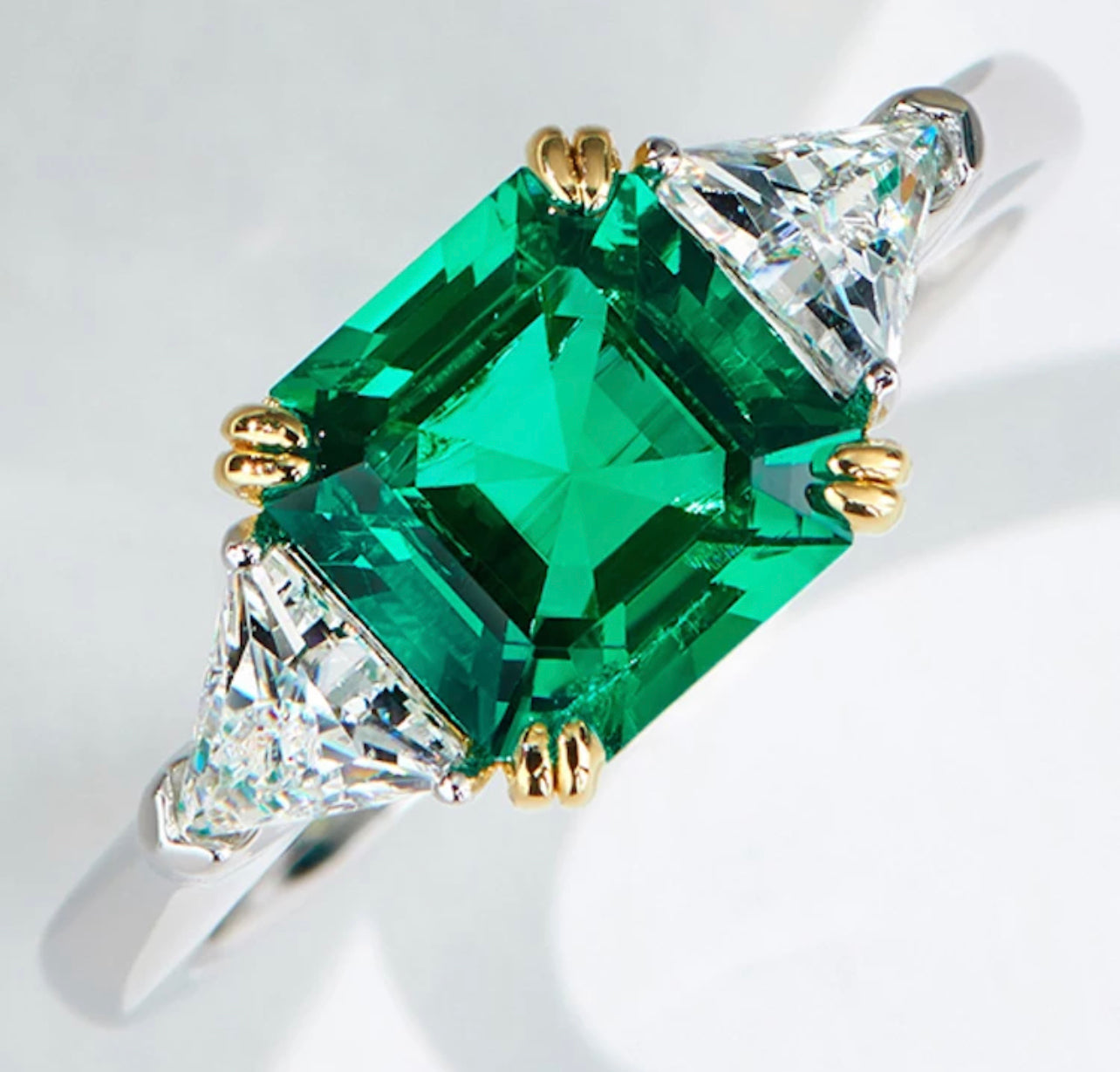 Three-stone Emerald Ring by Intricata co.