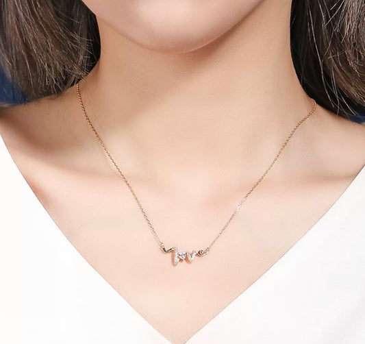 “I Wear Love On” Necklace by Intricata co.